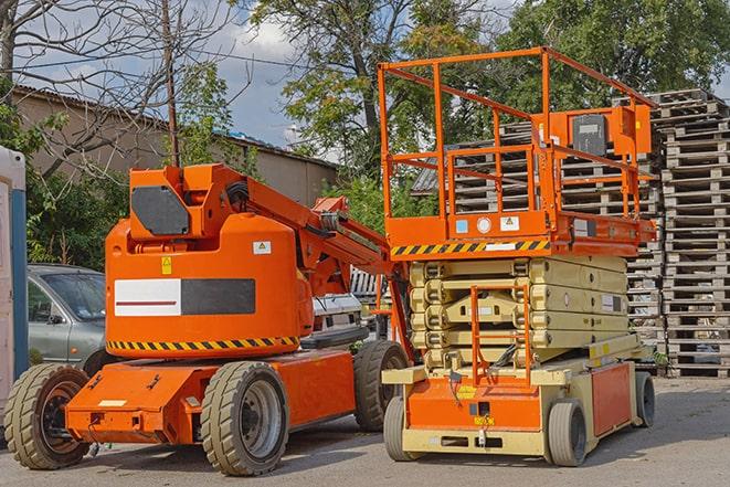 forklift carrying pallets in warehouse in Los Osos